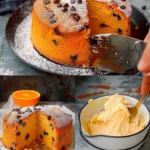 Orangenkuchen mit Schokoladenstückchen auf einem weißen Teller